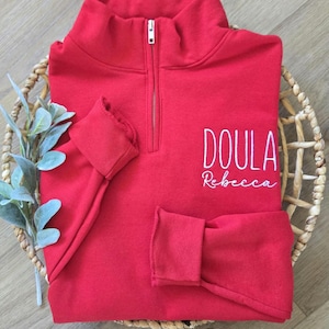 A true red sweatshirt with white thread.