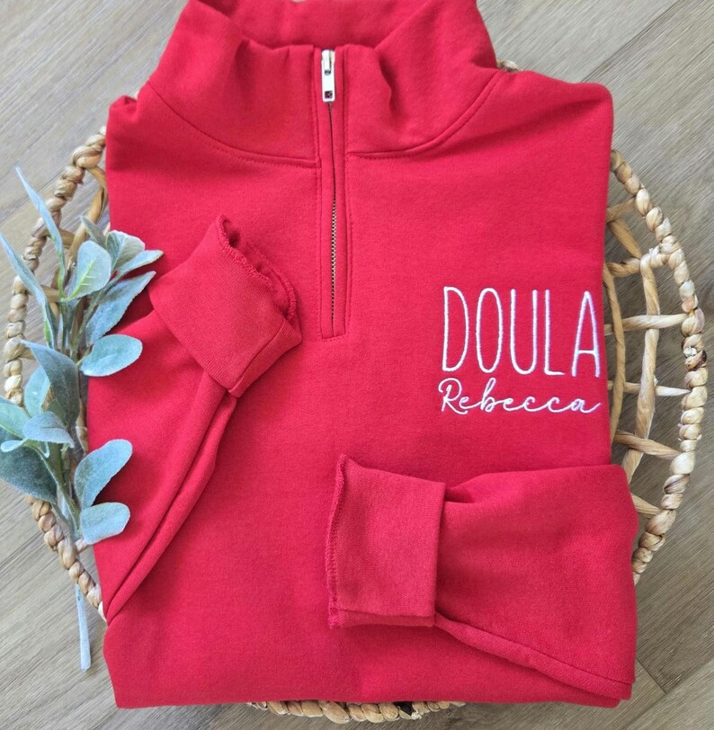 A true red sweatshirt with white thread.