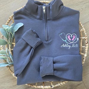 Labor and Delivery Nurse Sweatshirt, L&D Quarter Zip Pullover, Custom RN Zip Sweater, Personalized Nurse Graduation Gift, NICU Nurse Shirt