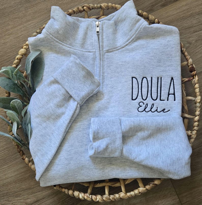 An ash sweatshirt with black thread.