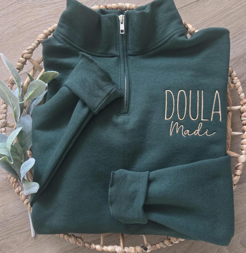 A forest green sweatshirt with vegas gold thread.