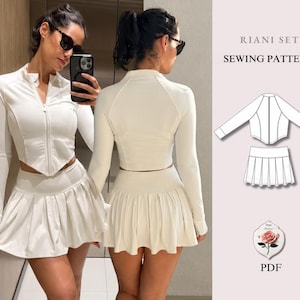 May include: A white two-piece set consisting of a long-sleeved, front-zipped crop top with a pointed hem and a pleated mini skirt. The image includes a technical line drawing of the Riani Set sewing pattern and a rose graphic labelled PDF.