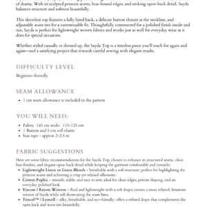May include: Text from a sewing pattern description for the Sayda Top. The pattern includes details on fabric suggestions, seam allowance, and required materials. The difficulty level is beginner-friendly. The pattern suggests fabric 145 cm wide, 110-125 cm.