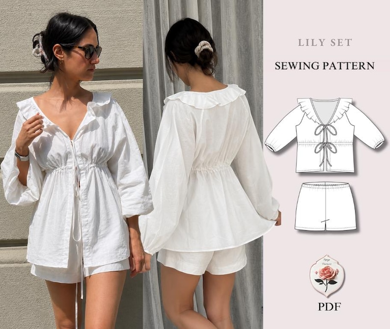 May include: A white two-piece set consisting of a long-sleeved top with a ruffled collar and front ties, and matching shorts. The image includes a technical line drawing labeled LILY SET SEWING PATTERN and a small rose graphic with PDF text.