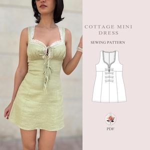 May include: A sewing pattern for a cottagecore mini dress with a lace trim and a bow detail. The pattern is available as a PDF download.  The text on the image reads "Cottage Mini Dress Sewing Pattern".