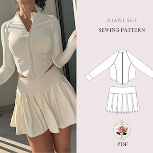 May include: A cream-colored athletic set featuring a long-sleeved zip-up top and a pleated mini skirt. The top has a high collar and thumbhole cuffs. The image also includes a sewing pattern with the text "RIANI SET SEWING PATTERN" and a PDF logo.