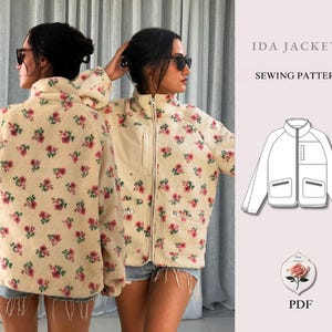May include: A cream-coloured fleece jacket with a repeating pink floral pattern, featuring a high collar, a full-length front zip, and two lower pockets. The text Ida Jacket Sewing Pattern and a rose graphic are displayed on the right side.
