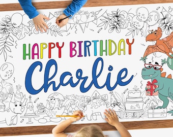 May include: A white coloring poster with a dinosaur theme. The poster says "Happy Birthday Charlie" in colorful letters. The poster has outlines of dinosaurs, plants, and other birthday party decorations that can be colored in.