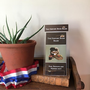 May include: A set of three ceramic mugs with a speckled, matte finish. The mugs are in shades of cream, light gray, and dark gray. Each mug has a simple, minimalist design, perfect for coffee or tea.