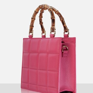 Top handle stylish Italian Handbag with matching pattern strap and bamboo handle. Genuine italian leather. Hot Pink