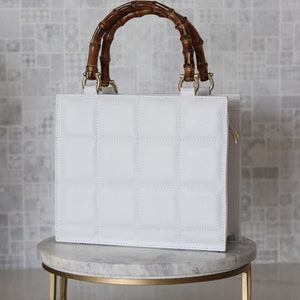 Top handle stylish Italian Handbag with matching pattern strap and bamboo handle. Genuine italian leather. image 1