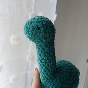 Dinosauro di peluche all'uncinetto Verde