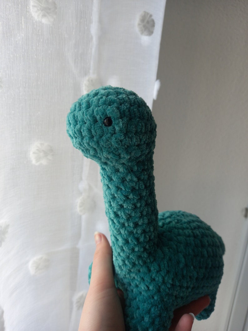 Dinosauro di peluche all'uncinetto Verde