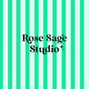 May include: A background with vertical stripes in alternating shades of mint green and white. The words "Rose Sage Studio" are in a black, elegant font, with a small star graphic.