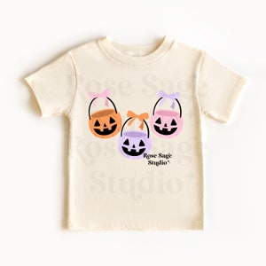 Arquivo PNG de baldes de abóbora, menina rosa laranja doce ou travessura PNG para camisa
