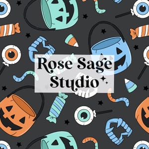 May include: A repeating pattern featuring Halloween-themed illustrations. The design includes jack-o'-lantern buckets, candy corn, candy, eyeballs on sticks, and vampire teeth on a dark gray background. The text "Rose Sage Studio" is in the center.