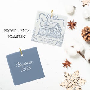Two square ceramic ornaments are shown, one white with a blue house illustration and text, and one blue with "Christmas 2025" in white script.