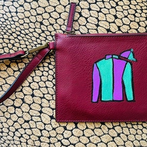 Exceptional hand painted wristlet clutch in awesome spring hues sporting jockey silks for Kentucky derby fans that want to win, place, show.