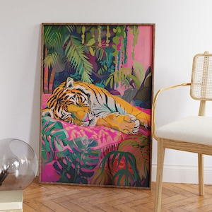 May include: A framed illustration of a tiger sleeping on a pink and green patterned cushion surrounded by lush tropical foliage. The tiger is orange and black with a pink nose and white stripes.