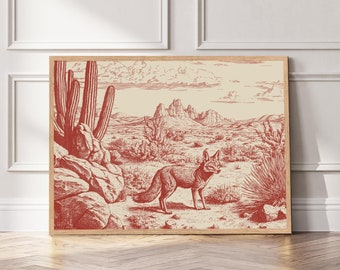 May include: A red and white illustration of a desert landscape with a fox in the foreground. The fox is standing on a rocky surface with cacti and other desert plants in the background. The illustration is framed in a wooden frame.