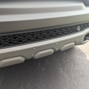 Ram TRX License Plate Hole Plugs - Color Matched to Skid Plate