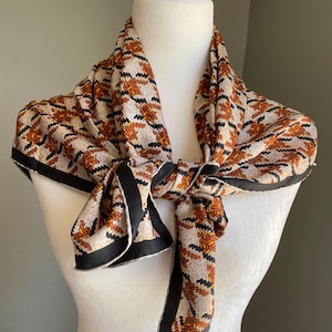 Vintage Rudi Gernreich silk scarf op art houndstooth plaid black orange cream mid century famous avant garde fashion designer 1960s 1970s