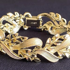 Vintage Lisner brushed goldtone bracelet leaf swirl design mid century elegant polished style 1950s 1960s style 7 inch long