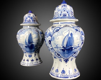 Pair of Delft ceramic vases with lids