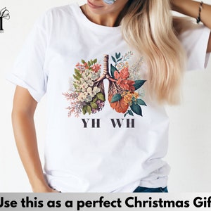 May include: White t-shirt with a floral design of lungs and the text "YH WH" printed on the front.