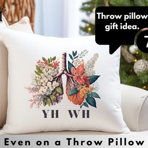 May include: White throw pillow with a floral design depicting lungs. The text "YH WH" is printed below the floral design. The text "Even on a Throw Pillow" is printed below the pillow.