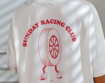 May include: White oversized t-shirt with a red graphic print of a tire with legs and the text "SUNDAY RACING CLUB".
