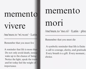 May include: Two framed art prints with black frames. The left print says "memento vivere" with a definition. The right print says "memento mori" with a definition. Both prints have black text on a white background.