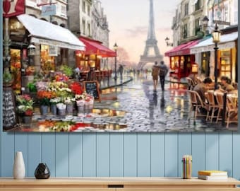 May include: A rectangular wall art print depicting a rainy Parisian street scene with a flower shop, outdoor cafe seating, and the Eiffel Tower in the distance. The painting features wet cobblestone streets, red awnings, and figures walking.