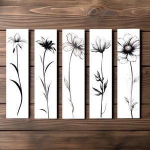 May include: Five black and white line drawings of different flowers on a white background. Each drawing is on a separate card.