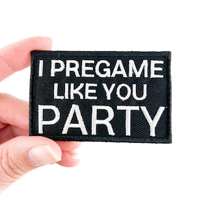 May include: Black embroidered patch with white text that reads "I pregame like you party".