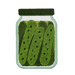 May include: An embroidered patch featuring a glass jar filled with three green pickles. The jar has a dark green lid and a light green outline. The pickles are textured with dark green spots, and the jar is depicted with white thread highlights.