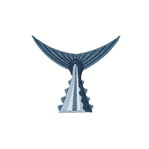 May include: Embroidered patch showing a stylized blue and white fish tail design. The tail fans out with detailed stitching, transitioning from dark to light blue. The base of the tail has a textured, layered appearance, creating a three-dimensional effect.