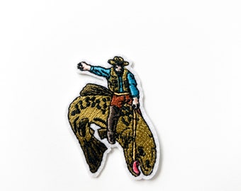 Cowboy Riding Bucking Trout Embroidered Iron-On Patch | Rodeo meets River Adventure | Perfect for Fishermen and Western Enthusiasts