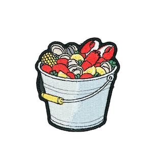 May include: A set of three ceramic nesting bowls in shades of blue, green, and white. The bowls have a speckled glaze and a simple, modern design. The largest bowl is about 15 cm in diameter.