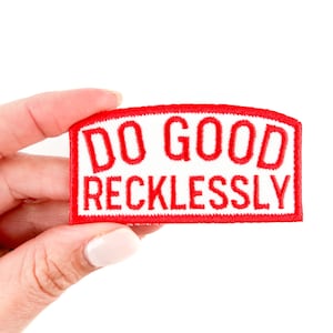 May include: Red embroidered patch with a white background. The patch says "Do Good Recklessly".