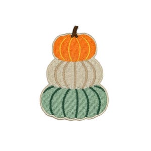 May include: An embroidered patch featuring a stack of three pumpkins. The top pumpkin is bright orange, the middle is cream, and the bottom is sage green. Each pumpkin has vertical stitching details and a small brown stem on top.