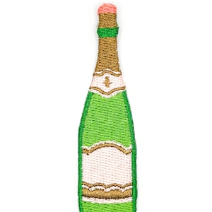 May include: An embroidered patch shaped like a champagne bottle. The bottle features a bright green body, a gold foil neck, a vibrant green neck band, and a pink cap. The label area is white with gold decorative scalloped borders and trim.