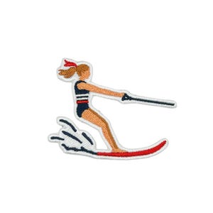 May include: An embroidered patch featuring a figure water skiing. The figure wears a navy blue swimsuit with white and red stripes, a red hair ribbon, and is holding a black tow rope. The water ski is red, and white stitching depicts water spray.
