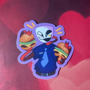 May include: A cartoon character wearing a blue uniform and a tie, holding two hamburgers with lettuce, tomato, and cheese. The character has a white face with a red mouth and a single eye with a yellow star.