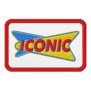 May include: A rectangular embroidered patch with a white background and a thick red border. The design features the word ICONIC in red letters with a blue outline, layered over a yellow and blue stylized arrow shape pointing to the right.