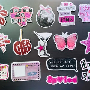 May include: A collection of colorful stickers with various designs and text. Designs include lips, hearts, a disco ball, a butterfly, a martini glass, and phrases like "You are so fetch" and "I am a mouse, duh!"