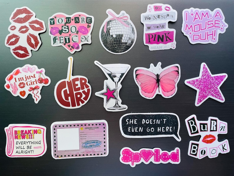 May include: A collection of colorful stickers with various designs and text. Designs include lips, hearts, a disco ball, a butterfly, a martini glass, and phrases like "You are so fetch" and "I am a mouse, duh!"