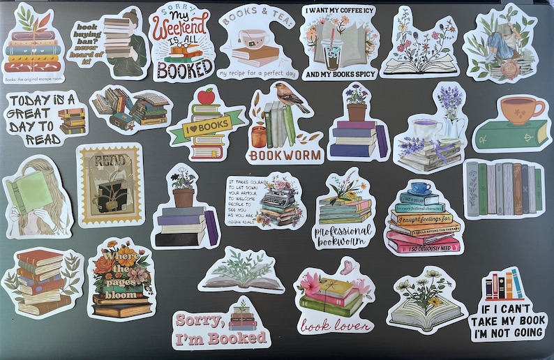 May include: A collection of colorful book-themed stickers featuring various illustrations and text, including "My Weekend is All Booked", "Today is a Great Day to Read", "I Love Books", "Bookworm", "Professional Bookworm", "Where the Pages Bloom", "Sorry, I'm Booked", "Book Lover", and "If I Can't Take My Book I'm Not Going".