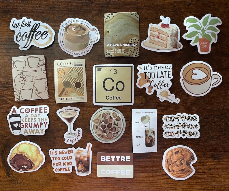 May include: A collection of coffee-themed stickers featuring various designs including cups of coffee, a slice of cake, a potted plant, a periodic table element labeled Co Coffee, and text phrases such as but first coffee, It's never TOO LATE For Coffee, and A COFFEE A DAY KEEPS THE GRUMPY AWAY.