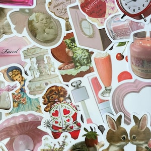 May include: A collection of vintage-style stickers featuring various designs, including a pink heart with the text "Be An Angel", a red and white cowboy boot with a puppy inside, a pink and white carousel, a pink heart-shaped frame, a brown rabbit, a pink perfume bottle, and a pink and white floral design.